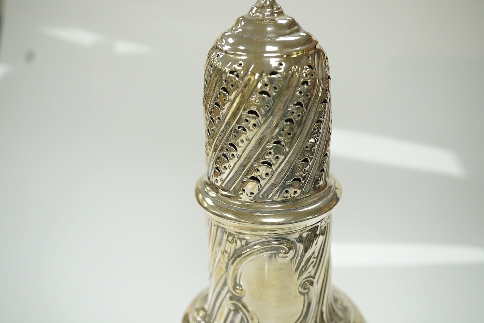 An Edwardian silver sugar caster, London, 1901, 22.6cm, together with a white metal box with hinged cover, gross weight 7.8oz. Condition - poor to fair